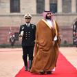 Saudi Crown Prince Mohammed bin Salman (C), pictured in India, authorized the Rapid Intervention Group to suppress dissidents, The New York Times reported