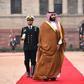 Saudi Crown Prince Mohammed bin Salman (C), pictured in India, authorized the Rapid Intervention Group to suppress dissidents, The New York Times reported