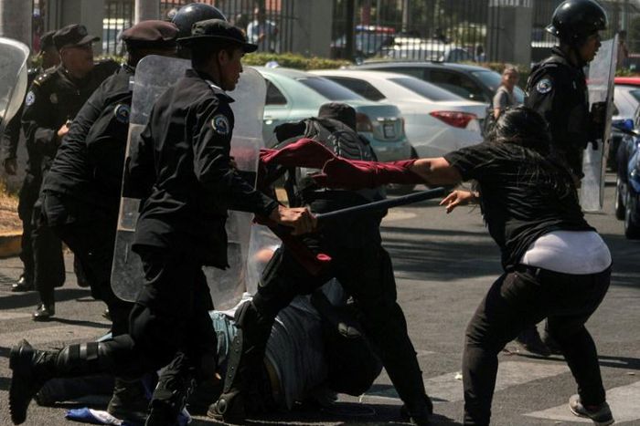 Nicaraguan police struggle with demonstrators in Managua, a day after the government pledged to restore the right to protest
