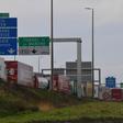 The men arrived at the Calais entrance to the Channel Tunnel linking France to England in a van filled with coffins, one of which contained an Iraqi migrant