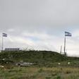 Israeli flags fly over a military base near the border fence with Syria in the Israeli-annexed Golan Heights, south of the Druze village of Majdal Shams