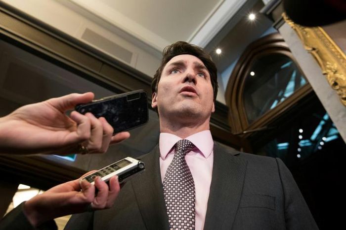 Prime Minister Justin Trudeau speaks to reporters before Question Period in the Canadian Parliament in late February 2019
