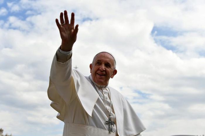 Pope Francis waves as he leaves St. Peter's square at the Vatican at the end of his weekly general audience on March 27, 2019