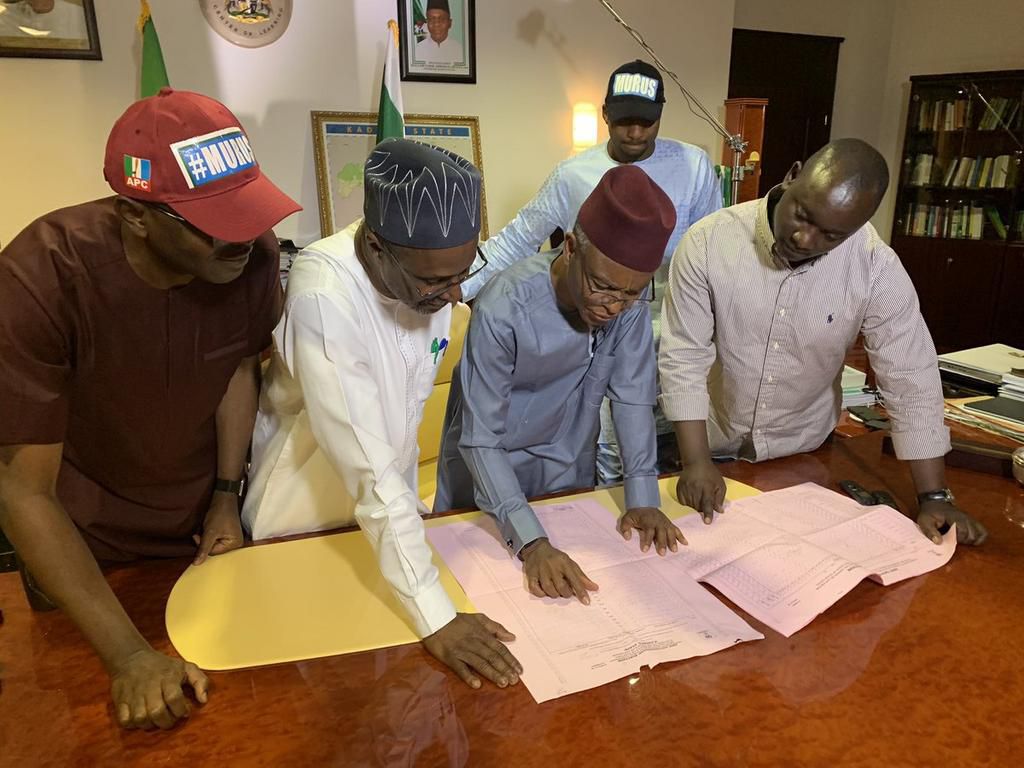 Presentation of the result sheet to the winner, Governor Nasir el Rufai by the SSG, Malam Balarabe Lawal, Senator-elect Suleiman Abdu Kwari and Senator-elect Uba Sani