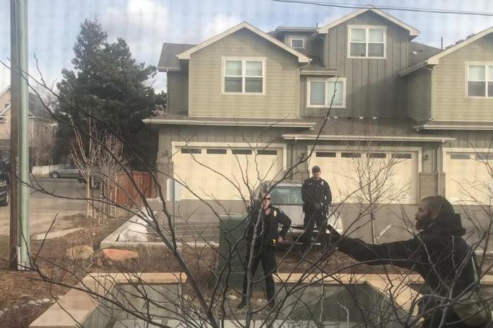 White officer placed on leave after detaining black man picking up trash in front of his building