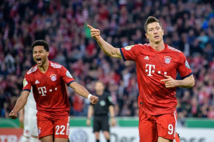 Robert Lewandowski sent Bayern Munich into the semi-finals of the German Cup with a late penalty on Wednesday