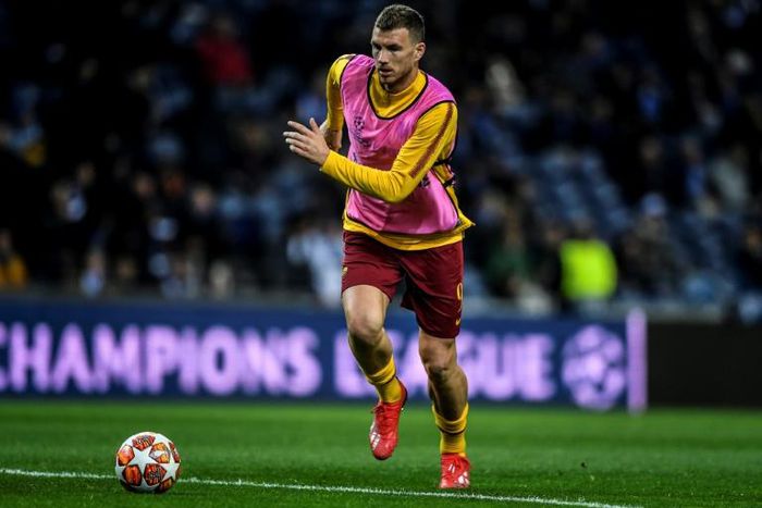 Edin Dzeko (pictured March 6, 2019) was presented with a shirt bearing the number "100" to mark his becoming the first Bosnian player to reach 100 international caps