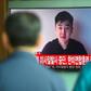 South Koreans watch a TV news item showing video footage Kim Han-Sol, a nephew of North Korea's leader Kim Jong-Un