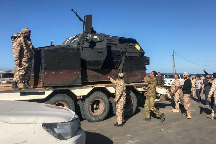 Dozens of armed vehicles were gathered Saturday in Tajura, in the suburbs east of Tripoli