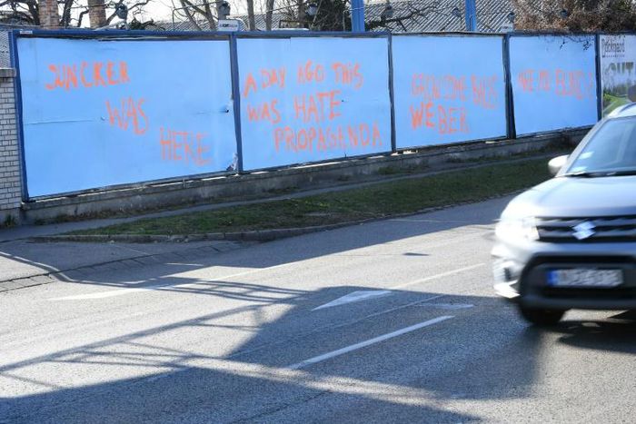Anti-EU posters covered up in Budapest as the leader of the EPP group Manfred Weber visited