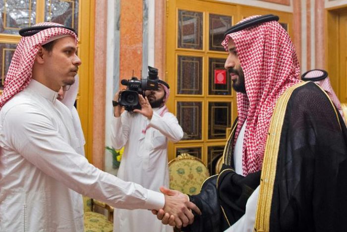 Saudi Crown Prince Mohammed bin Salman, right, shakes the hand of Salah Khashoggi, son of slain journalist Jamal Khashoggi, in Riyadh in October 2018