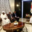 Sudanese President Omar al-Bashir (R) chairs a meeting of leaders of political parties in the capital Khartoum