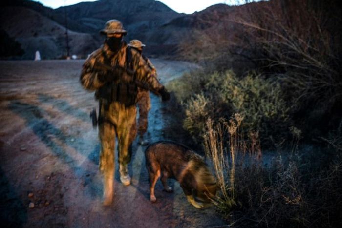 Members of the Constitutional Patriots New Mexico Border Ops Team militia, Viper and Stinger who go by aliases to protect their identity, patrol the US-Mexico border in Sunland Park, New Mexico on March 20, 2019