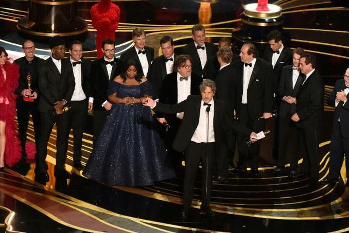 Producers accept the best picture Oscar for "Green Book," which has taken more than $140 million in box offices worldwide, but sparked controversy