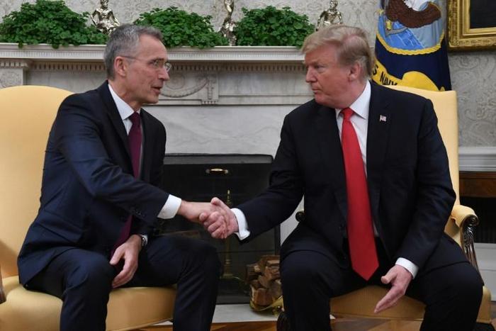 US President Donald Trump shakes hands with NATO Secretary General Jens Stoltenberg at the White House
