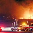 Fanned by strong winds the fire quickly spread through the mountainous area close to the border with North Korea, incinerating 400 homes and 500 hectares of land