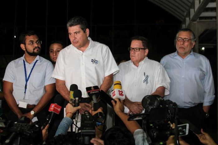 Juan Sebastian Chamorro (2-L), of the opposition delegation to talks with the Nicaraguan government, speaks during a press conference in Managua after the two sides reached an agreement on restoration of freedoms and disarming paramilitaries