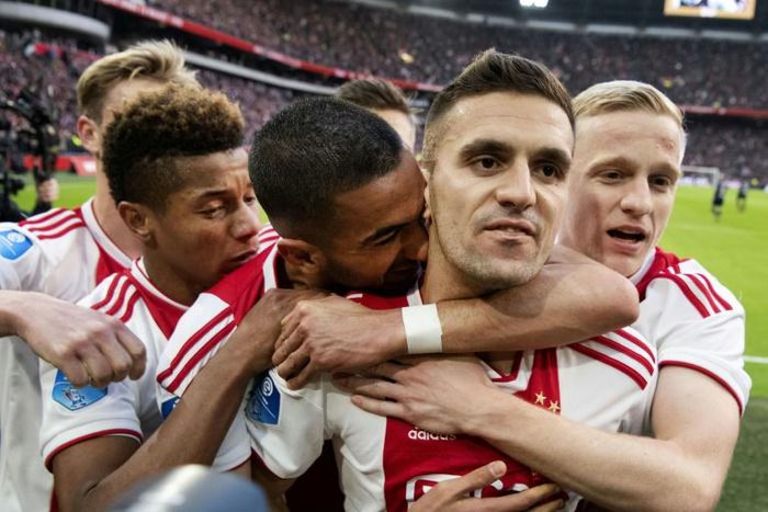Dusan Tadic (2R) celebrates with his Ajax teammates after scoring in the recent win over PSV Eindhoven