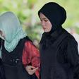 Vietnamese woman Doan Thi Huong arrives at the Shah Alam High Court escorted by Malaysian police officers