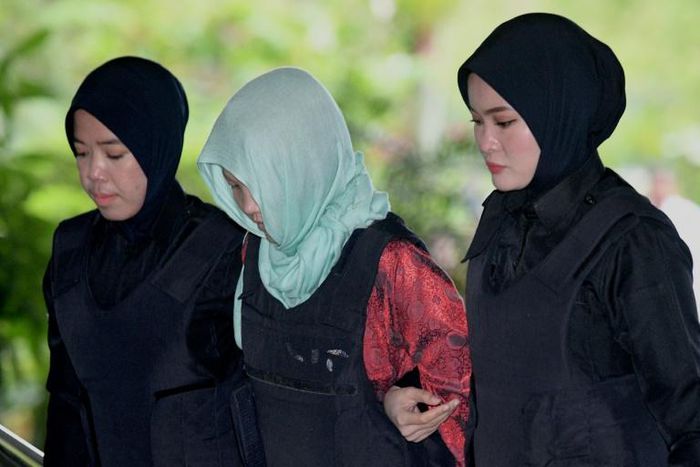 Vietnamese woman Doan Thi Huong arrives at the Shah Alam High Court escorted by Malaysian police officers