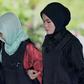 Vietnamese woman Doan Thi Huong arrives at the Shah Alam High Court escorted by Malaysian police officers