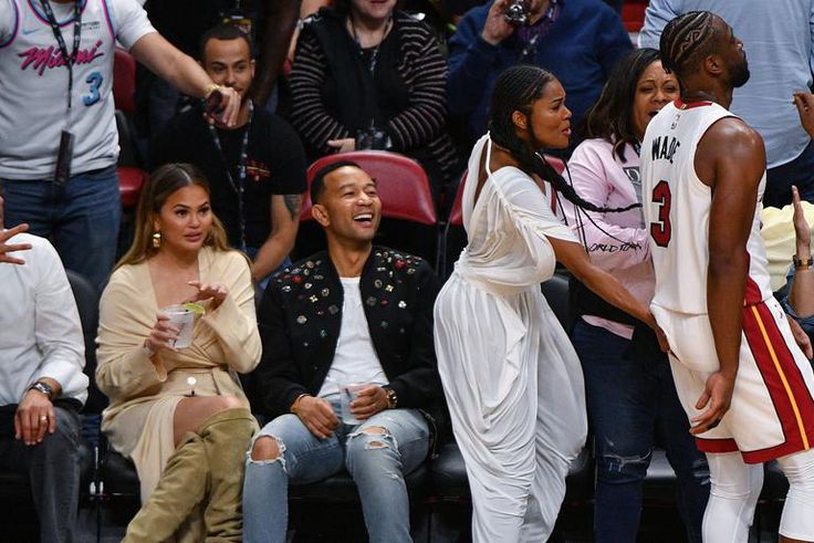 Wade Collides With Legend, Teigen In Iconic Photo