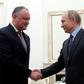 Dodon (L), an ally Putin (R, has pushed for Moldova to join the Moscow-dominated Eurasian Economic Union