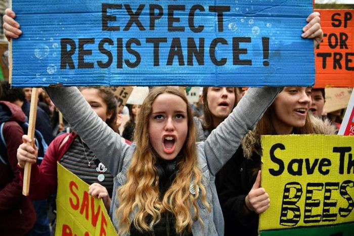Students attend the YouthStrike4Climate demonstration against climate change in Parliament Square, central London on April 12, 2019