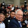 Former prime minister Najib Razak (shown at the start of his trial on April 3) and his cronies are accused of stealing billions of dollars from 1MDB and spending it on everything from high-end real estate to artworks and a luxury yacht