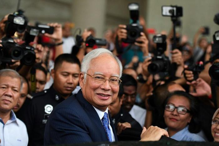 Former prime minister Najib Razak (shown at the start of his trial on April 3) and his cronies are accused of stealing billions of dollars from 1MDB and spending it on everything from high-end real estate to artworks and a luxury yacht
