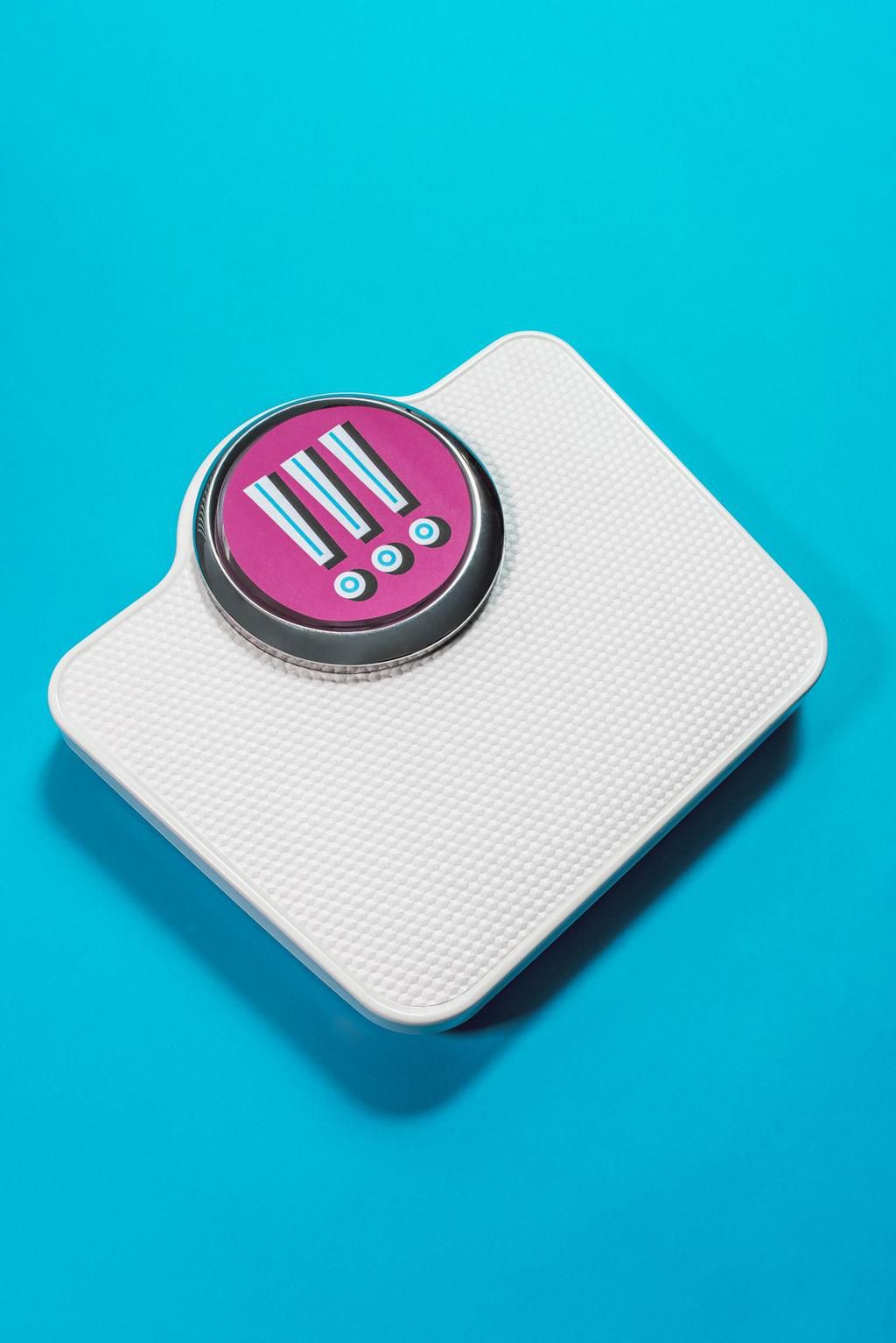 Conceptual bathroom scales with exclamation marks in the display