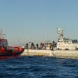Sailors with the Spanish emergency services (L) and the Moroccan Navy rescue would-be immigrants in the Straits of Gibraltar in December 2012