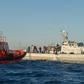 Sailors with the Spanish emergency services (L) and the Moroccan Navy rescue would-be immigrants in the Straits of Gibraltar in December 2012