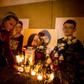 A woman (pictured February 2019) places candles next to a memorial for journalist Jan Kuciak and his fance Martina Kusnirova, who were gunned down in their home in February 2018