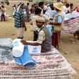 Yemenis displaced from areas near the border with Saudi Arabia receive humanitarian aid given by the Norwegian Refugee Council (NRC) and the UN High Commissioner for Refugees (UNHCR) in the northern province of Hajjah on March 11, 2019