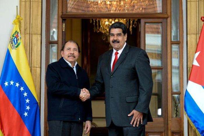 Presidents Daniel Ortega of Nicaragua and Nicolas Maduro of Venezuela shake hands during a regional meeting in Caracas in March 2018