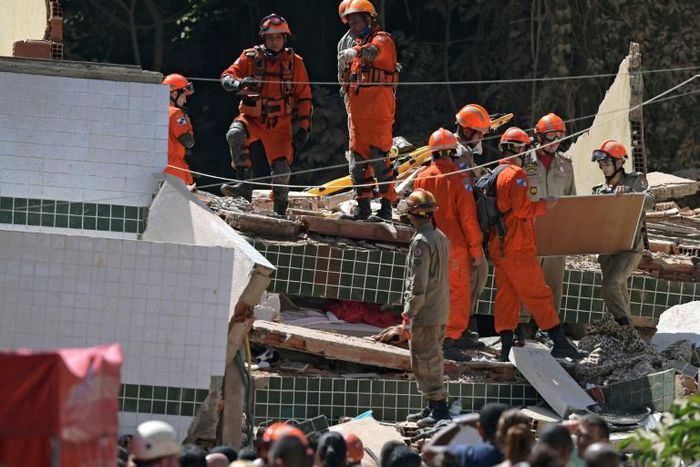 Rescue workers at the site where two buildings collapsed in Muzema, Rio de Janeiro, Brazil, on April 12, 2019