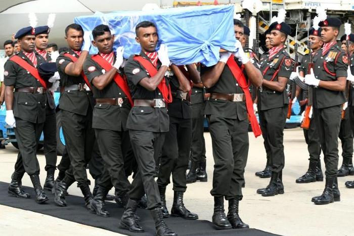 UN peacekeepers from Sri Lanka carry the coffin of a Sri Lankan soldier killed in an attack on a convoy in Mali