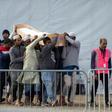 Mourners prepare to bury one of the victims of the Christchurch shootings on Friday, a week after a gunman shot dead 50 worshippers