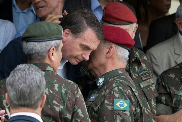Brazilian President Jair Bolsonaro, pictured in 2018 talking to army general Luiz Eduardo Ramos Baptista Pereira, is an unabashed admirer of Brazil's former dictators