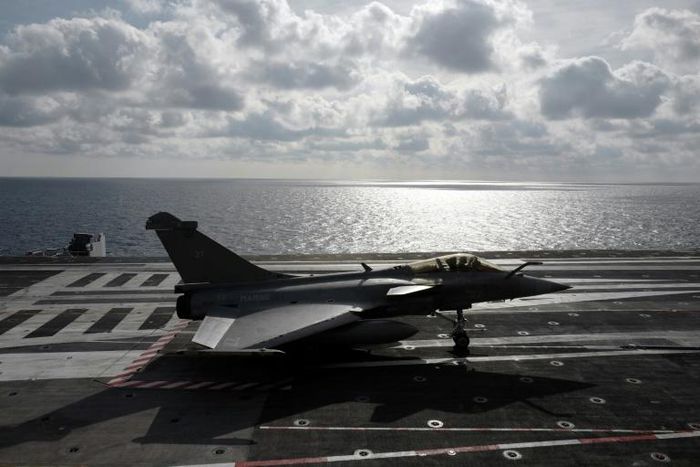 A Rafale fighter jet lands on the Charles De Gaulle in the Mediterranean on February 7, 2019.