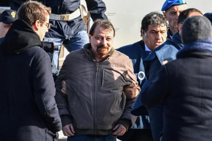 Italian former communist militant Cesare Battisti (C) has admitted all the charges brought against him "in four murder cases" carried out in the 1970s