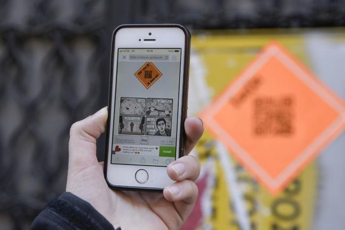 Walking through the streets of Athens, visitors look for the brightly-coloured QR code which they then scan to get a short description of the attack that took place there
