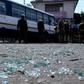 Indian police inspect the site of a grenade blast at a bus station in Jammu