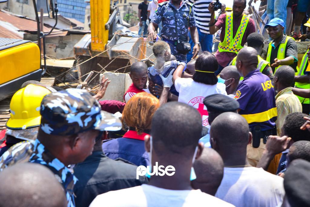 A school child being taken out of the rubble (Pulse)