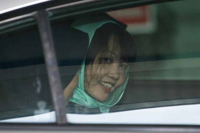 All smiles: Doan Thi Huong, who was accused of murdering the half-brother of North Korea's leader, smiles after her charge was reduced