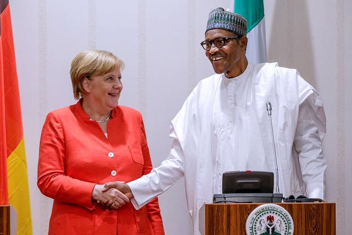 President Buhari in a handshake with German Chancellor Merkel at the State House (Thisday)