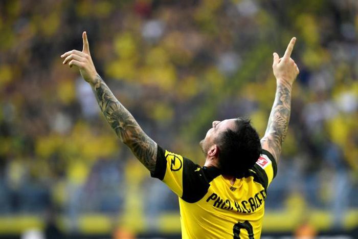 Borussia Dortmund's Spanish striker Paco Alcacer claimed a hat-trick off the bench when the Bundesliga leaders won a seven-goal thriller against Friday's opponents Augsburg when the sides last met