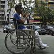 A patient leaves after receiving treatment for kidney failure at a state-run clinic in Caracas, on March 10, 2019