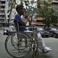 A patient leaves after receiving treatment for kidney failure at a state-run clinic in Caracas, on March 10, 2019
